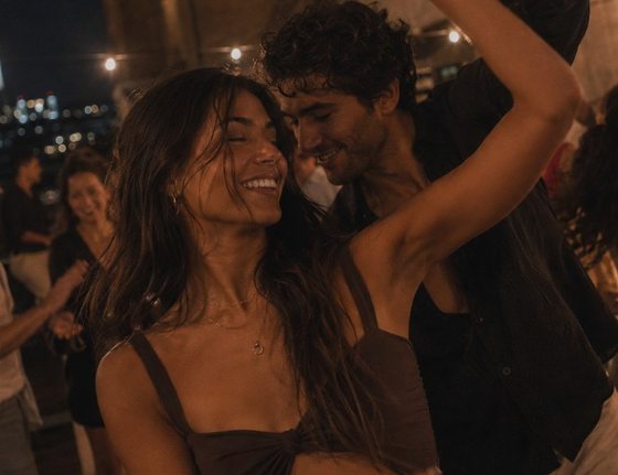 A couple dancing at a night event